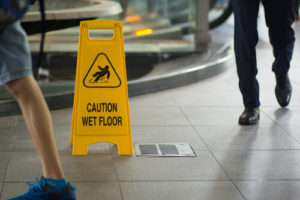 caution floor sign to prevent slip and falls